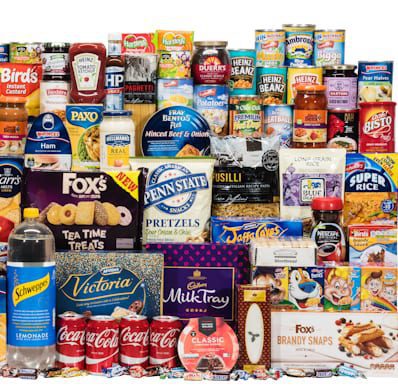 Assorted food and snack products including snacks, drinks, and confectionery items.
